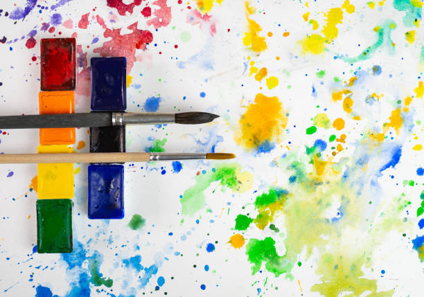istock Watercolor and brushes at bright background. Flat lay, top view. 1312101179