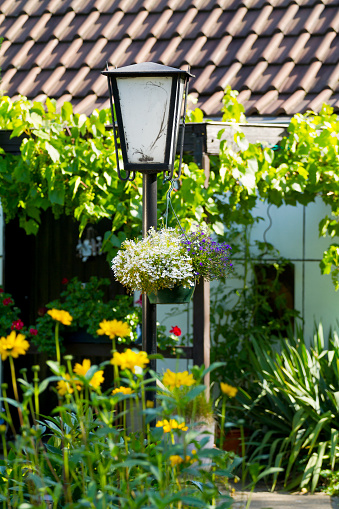 Lantern and front yard in front of old small house