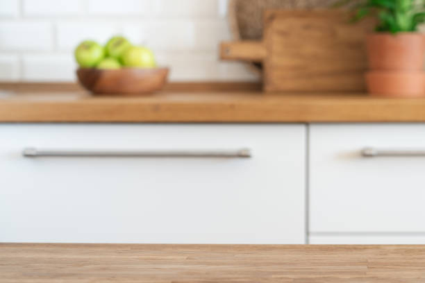 istock Kitchen table against the background of blurred modern home light kitchen 1312101610