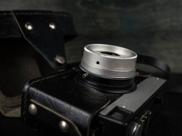 istock Vintage camera on a black background. Retro photo camera. Vintage. 1312102692