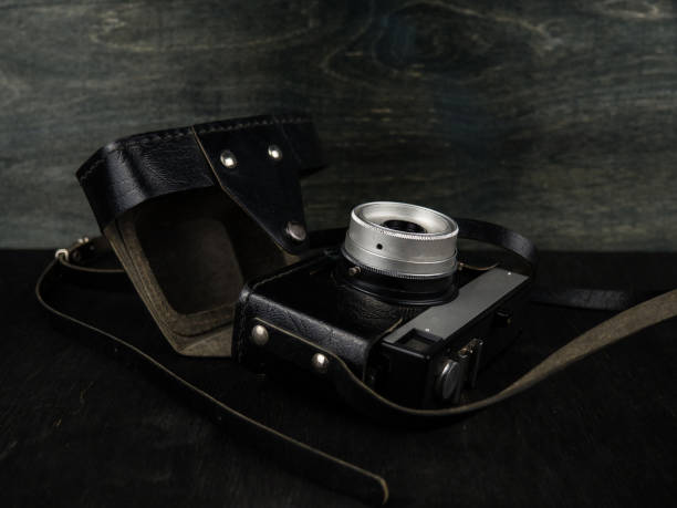 istock Vintage camera on a black background. Retro photo camera. Vintage. 1312102696