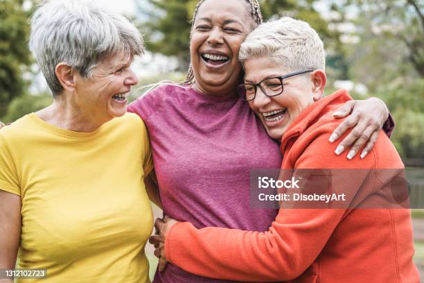 Multiracial Senior Women Having Fun Together After Sport Workout Outdoor Main Focus On African Female Face Stock Photo - Download Image Now