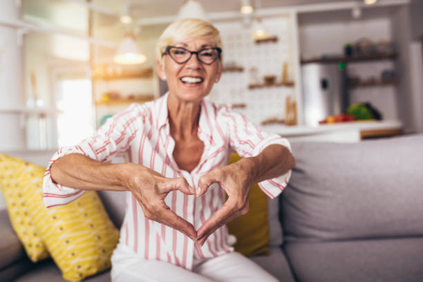 istock Senior woman talking using sign language at home. 1312102864