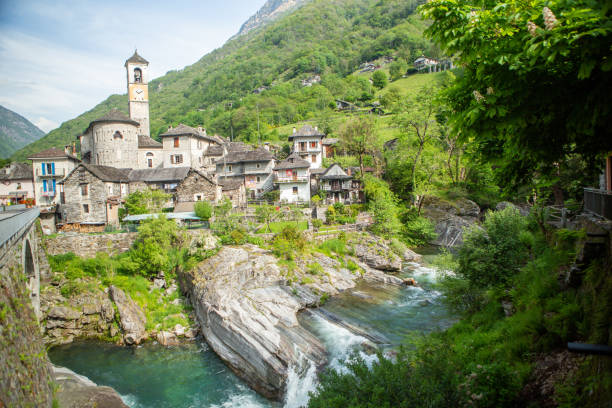istock Waterfall and typical stone village in Ticino 1312103481