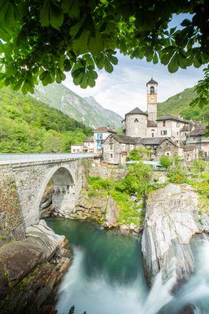 istock Waterfall and typical stone village in Ticino 1312104564