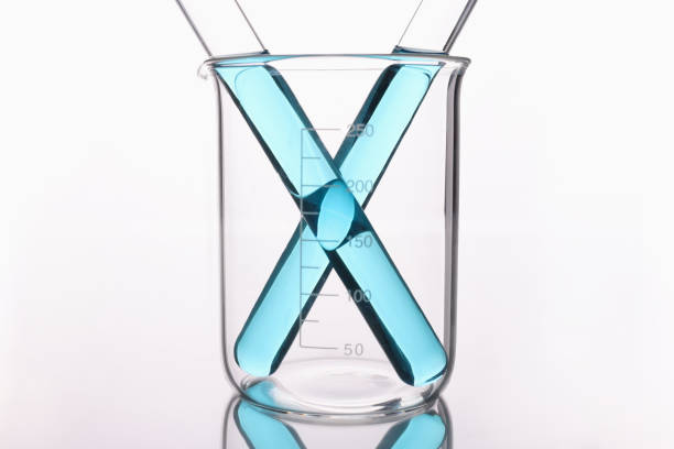 Two test tubes with unprotected liquid in a glass beaker. Chemical industry concept