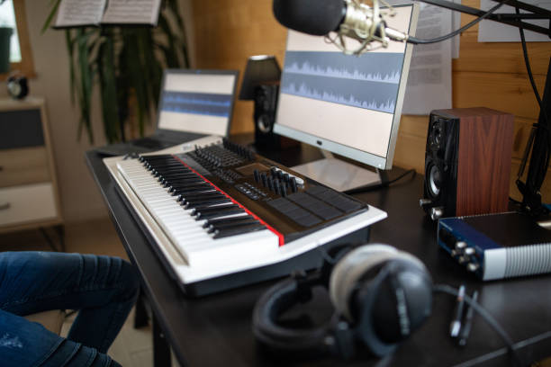 istock Young man composing music on electric piano in recording studio at home 1312105143