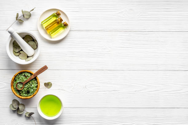 istock Essential oil in glass bottle, herbs with eucalyptus. Space for text 1312105153