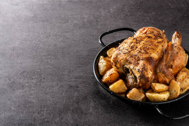 istock Homemade roasted chicken with potatoes 1312105222
