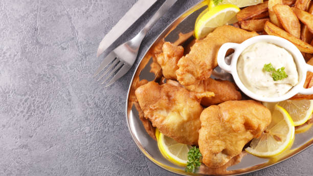 istock fish and chips- fried breaded fish and french fries 1312106328