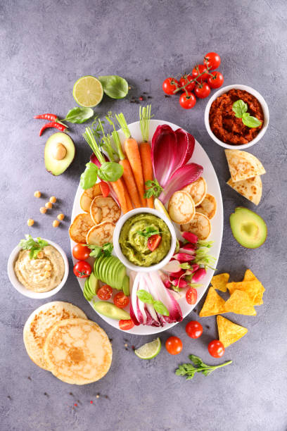 istock variety of fresh vegetable and dips 1312106329