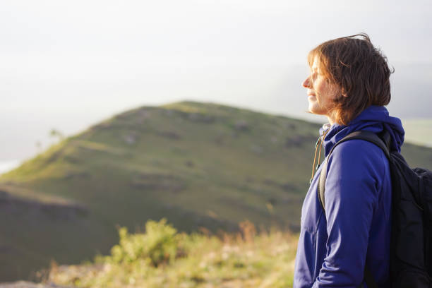 istock Young woman walking in nature 1312106357