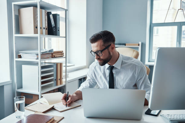istock Concentrated young man in shirt and tie 1312106472