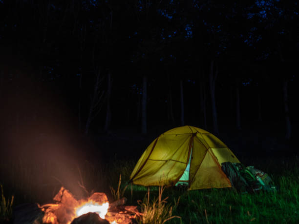 istock Tents on mountain top, night shot 1312106596
