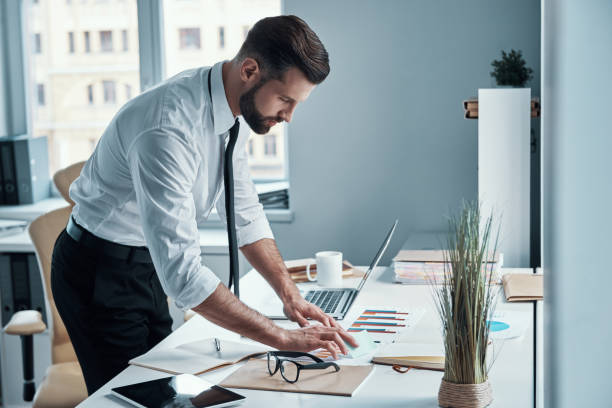 istock Confident young man in shirt and tie 1312107454