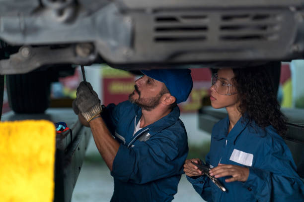 istock Auto services concepts. Mechanic reparing the car in the workshop garage. 1312107530