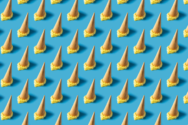 Melted yellow ice cream cone creative pastel seamless pattern blue background
