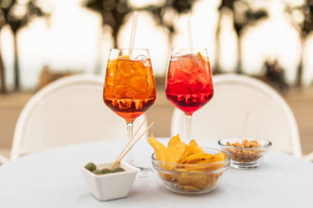 istock Italian refreshing cocktails with snacks on the table on a summer evening 1312109028