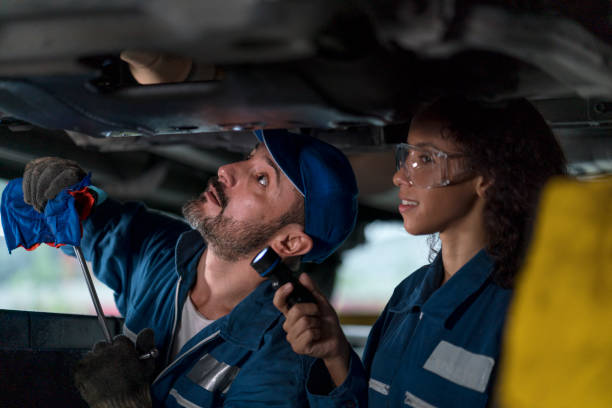 istock Auto services concepts. Mechanic reparing the car in the workshop garage. 1312109149