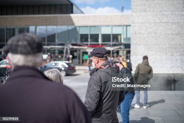 A Man With A Face Mask In Front Of A Vaccination Center In Berlin Stock Photo - Download Image Now