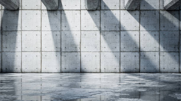 istock Concrete wall with reflections in the wet ground - background 1312112170