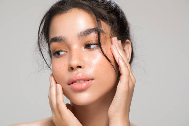 Young woman beauty portrait Close up studio shot of a beautiful young woman with perfect glow skin. human lips stock pictures, royalty-free photos & images