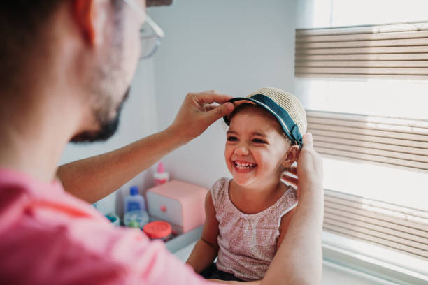 istock Father taking care of daughter and playing 1312114438