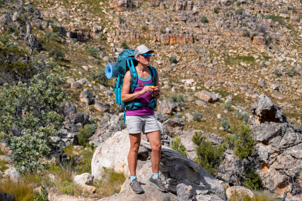 istock Active woman hiking and enjoying nature 1312114540
