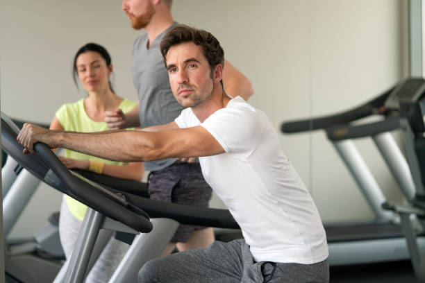istock Fit people working out at the gym 1312115040