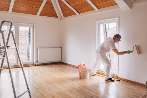 istock Mature painter painting a wall 1312116478