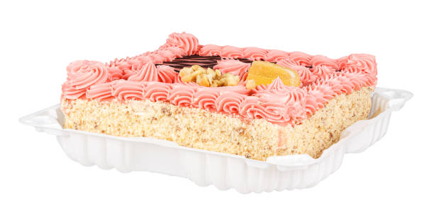 istock Square shape shortcrust pastry cake with chocolate glaze and pink cream in plastic container isolated on white background 1312116680