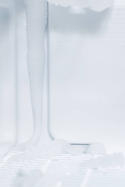 domestic fridge freezer defrost problem concept. refrigerator covered with ice. appliance repair concept - defreeze imagens e fotografias de stock