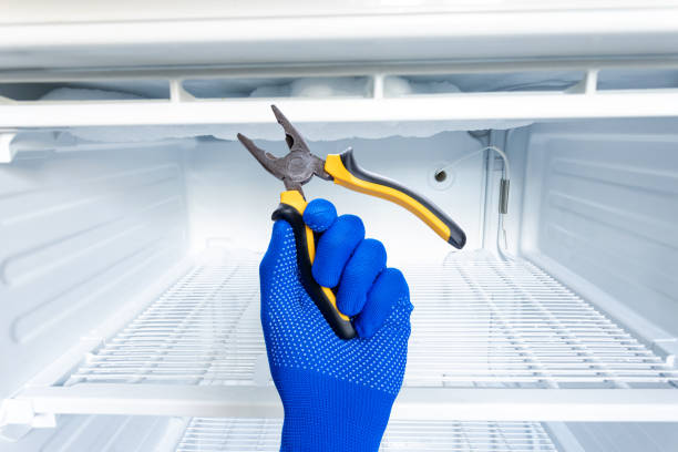 domestic fridge freezer defrost problem concept. refrigerator covered with ice. appliance repair concept - defreeze imagens e fotografias de stock