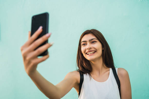 istock Young woman taking selfies with phone. 1312120543