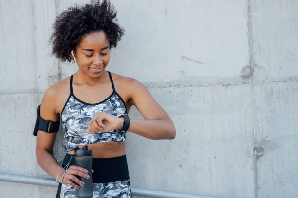 istock Fitness woman checking time on smart watch. 1312120547
