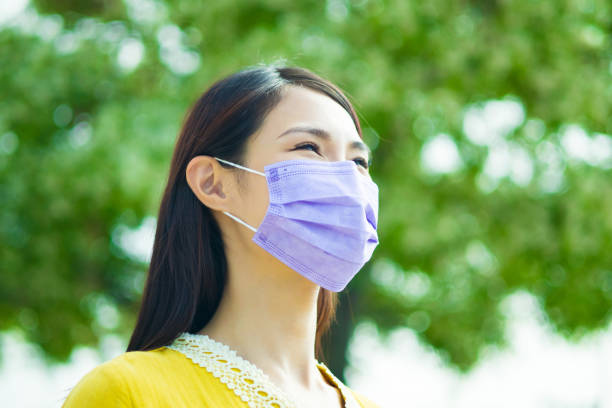 istock asian female wear face mask 1312121660
