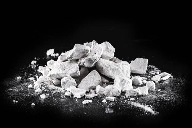 istock Calcium and Magnesium stones, black background. Called virgin lime or quicklime 1312123855