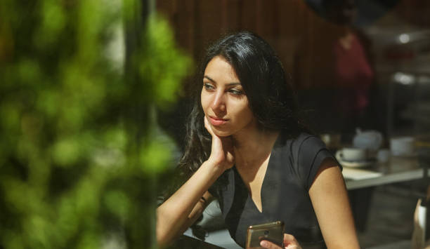 istock beautiful spring dreamy girl in a cafe 1312124694