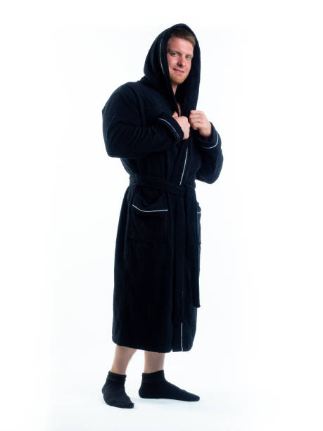 istock strong man in a Bathrobe on an isolated white background with a smile on his face. 1312124714
