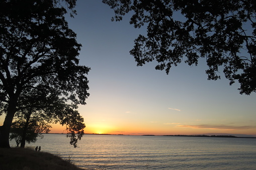 Orange Sunset at Folsom Lake Silhouette Photos