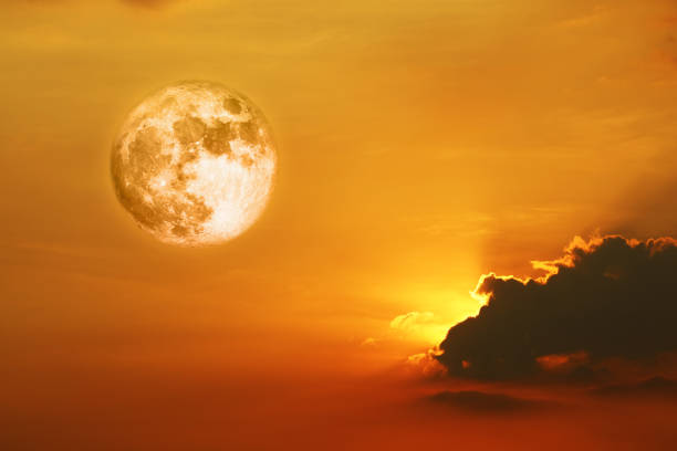 istock full crust moon and orange yellow red silhouette sky in sunset back on the cloud 1312125682