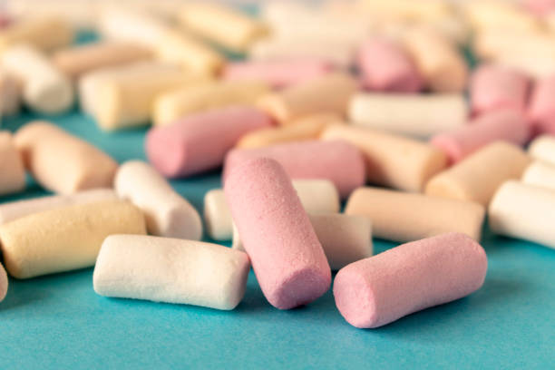 istock Colorful marshmallows on a blue background. Close-up. Selective focus. 1312126898