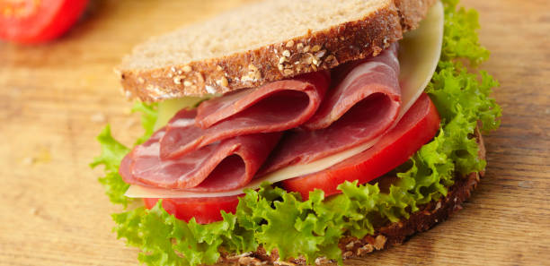 istock fresh deli sandwich with tomatoes, swiss chees, lettuce 1312129776