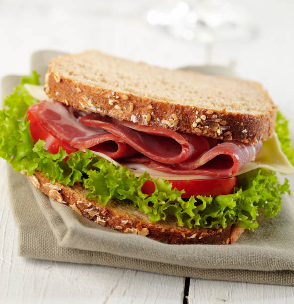 istock fresh sandwich with tomatoes, swiss chees, lettuce 1312129804