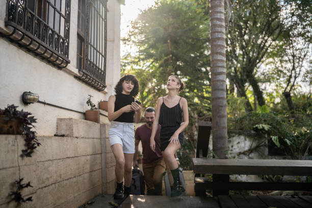 istock Transgender couple checking on smartphone while arriving at hostel 1312131227