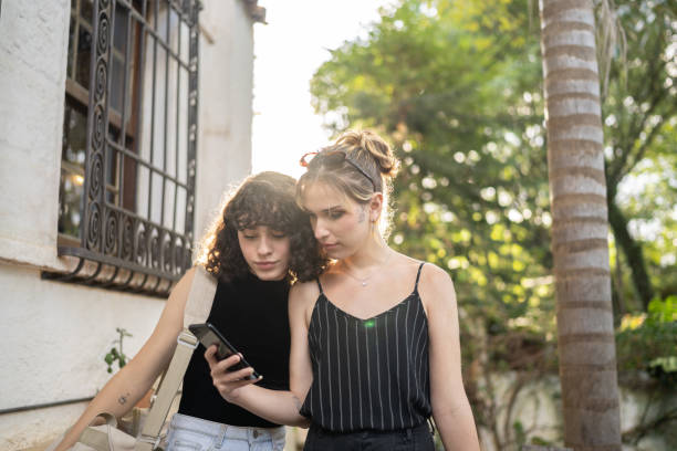 istock Transgender couple checking on smartphone while arriving at hostel 1312131264