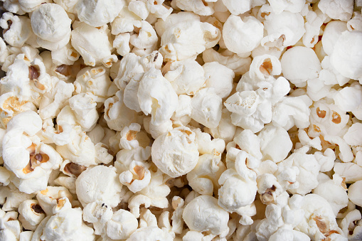 Fresh salt popcorn closeup as a background