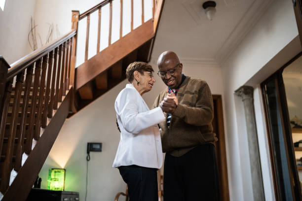 istock Senior couple dancing at home 1312135617
