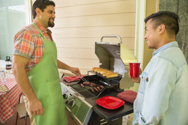 istock Multi ethnic group of young men at a cook out. 1312135696