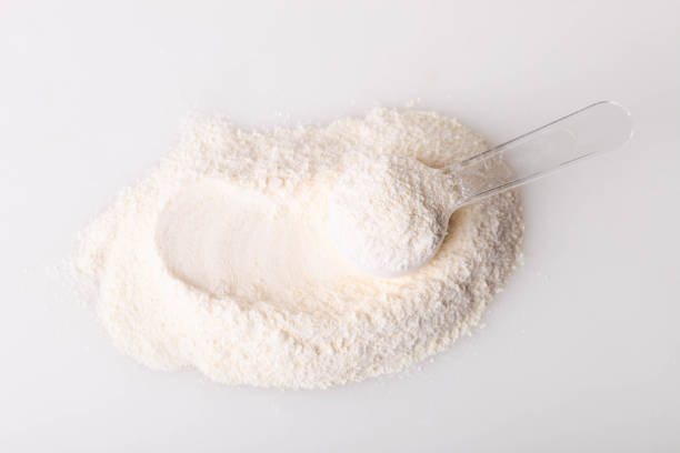 istock Heap of white protein powder with measuring spoon 1312137764